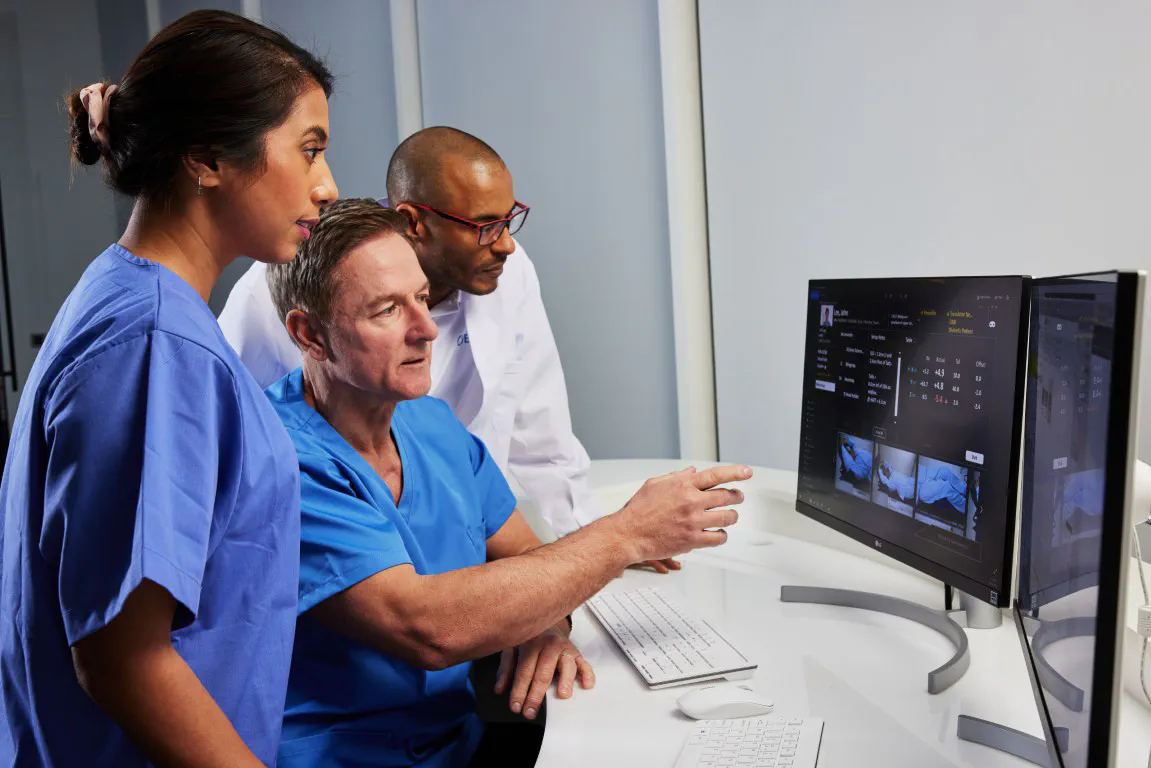 Clinicians at a computer desk using Elekta Software